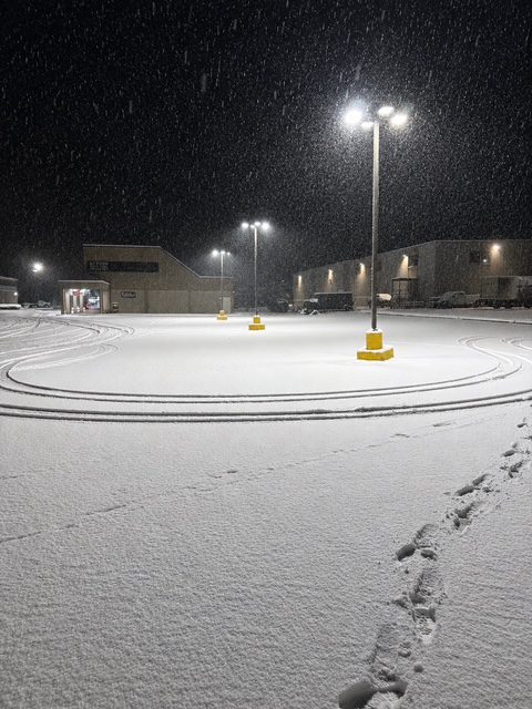 Snow-covered commercial parking lot plowed by M&C Venture Works in Totowa, NJ during a snowstorm